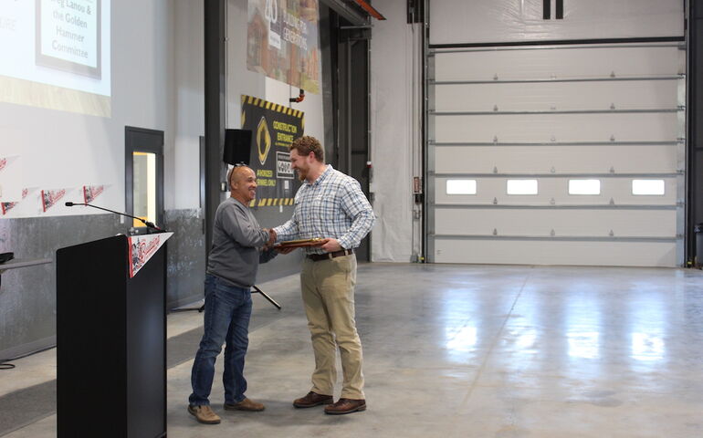 Two people shake hands at Wright-Ryan.