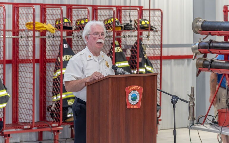 Limerick's fire chief speaks at a podium.