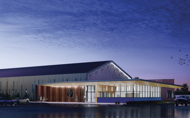 This rendering shows a building at dusk.