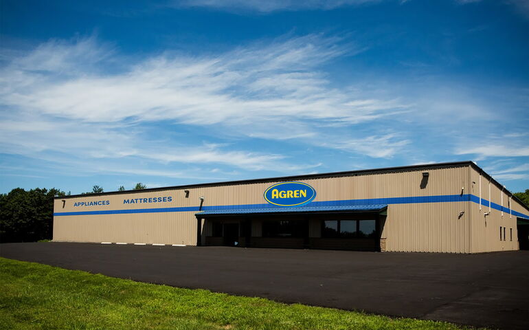 A composite image shows a building with a sign.
