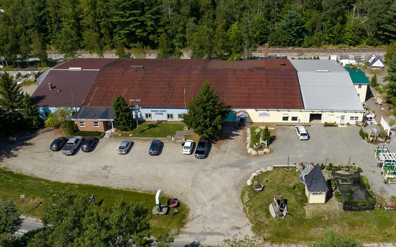 An aerial view shows a long building.