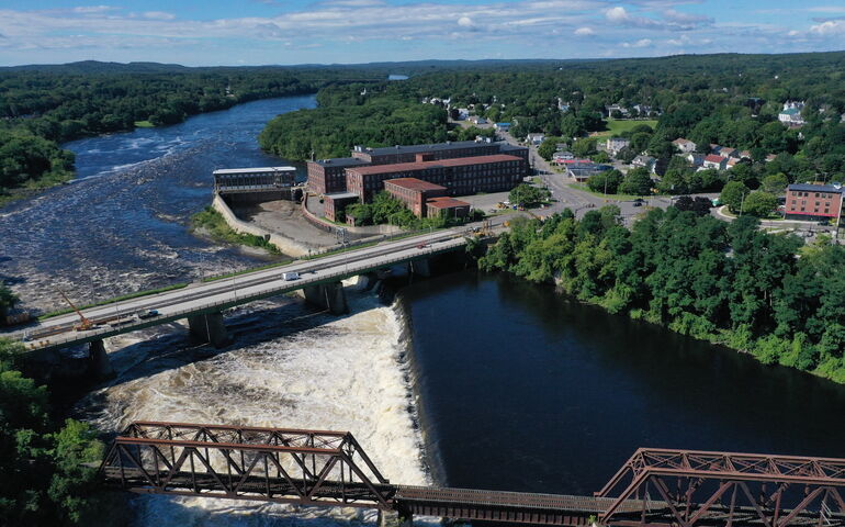 Aerial view of the Hathaway Center and a river and bridges.