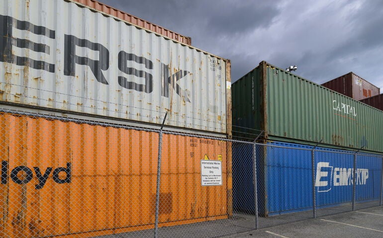 Cargo containers under dark clouds 