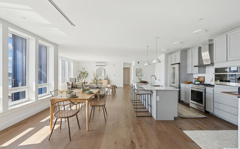 An interior view of a kitchen and dining area.
