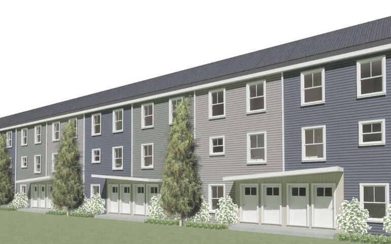 A rendering shows a long building with multiple doors.