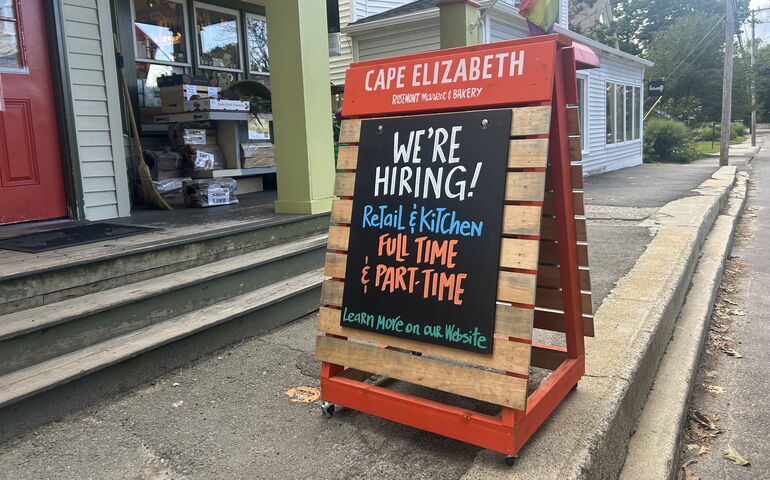 Hiring sign outside a store 