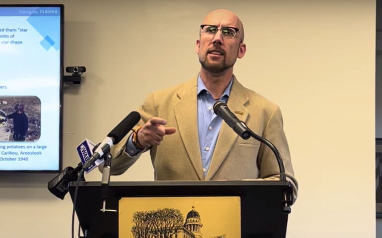 A person stands at a podium.