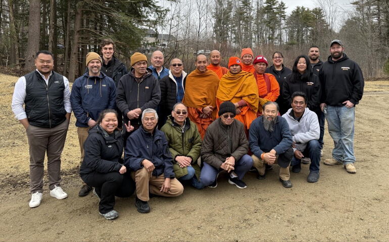 People pose for a group shot.