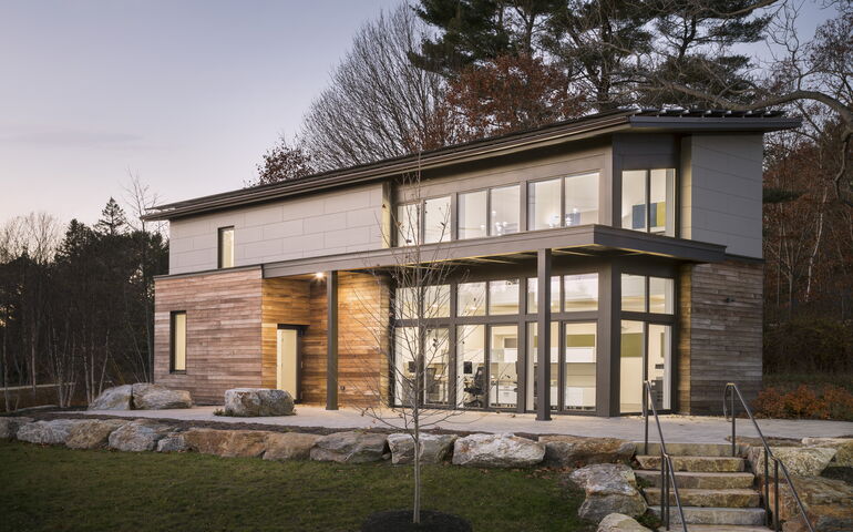 An exterior view of a building with patio.
