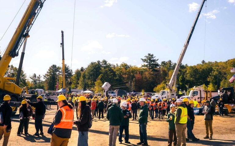 A group stands outside.
