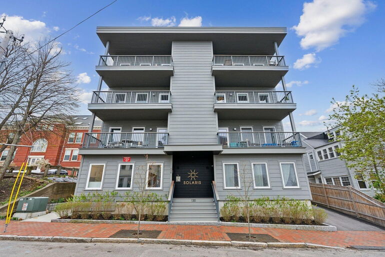 An exterior view shows the front of a building.