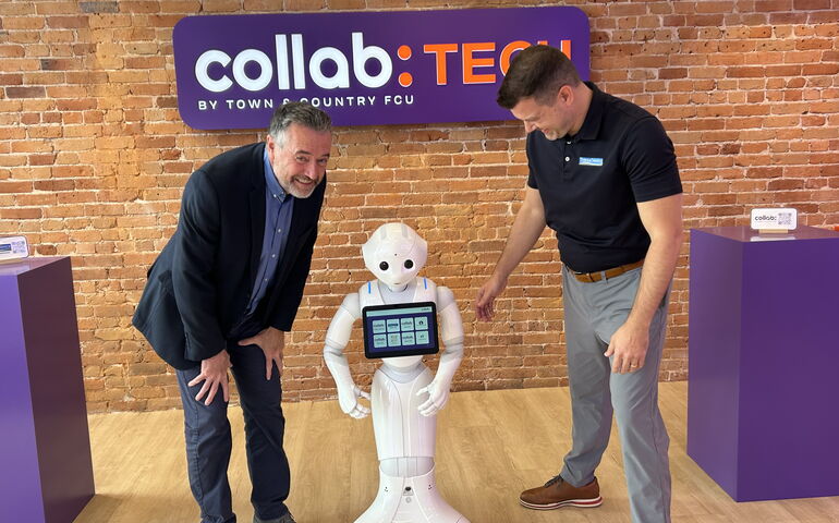 Pepper the robot with two people from Town & Country FCU 