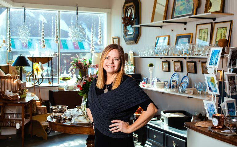 Barbara Konsin in her home decor store, in front of the window