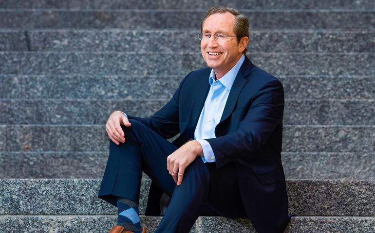 David Whitaker sitting on steps.