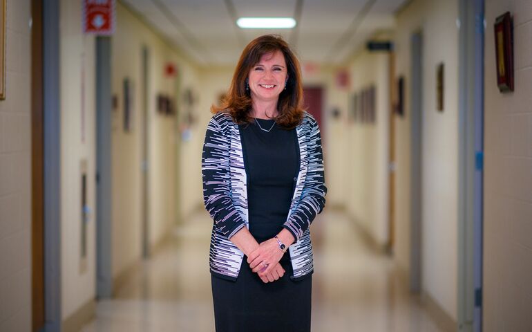 Tricia Costigan standing in hospital hallway 