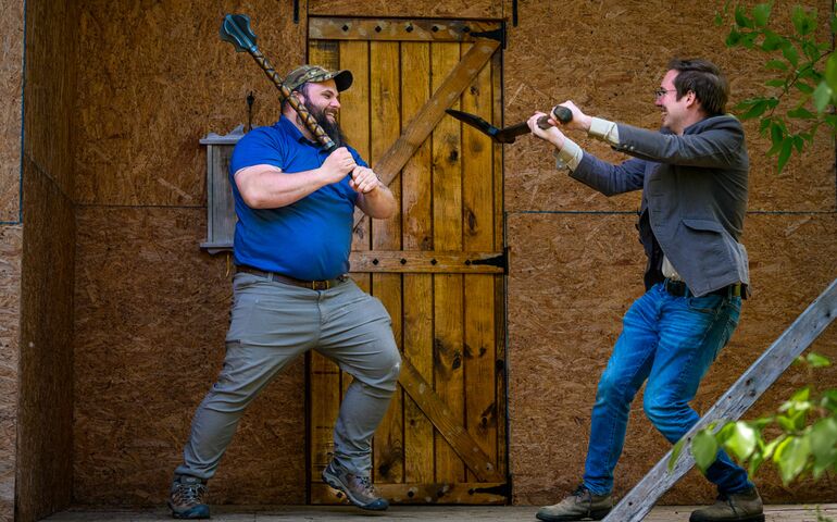 Two men jousting 