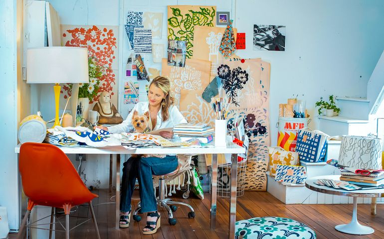 Erin Flett in her design studio at a desk 