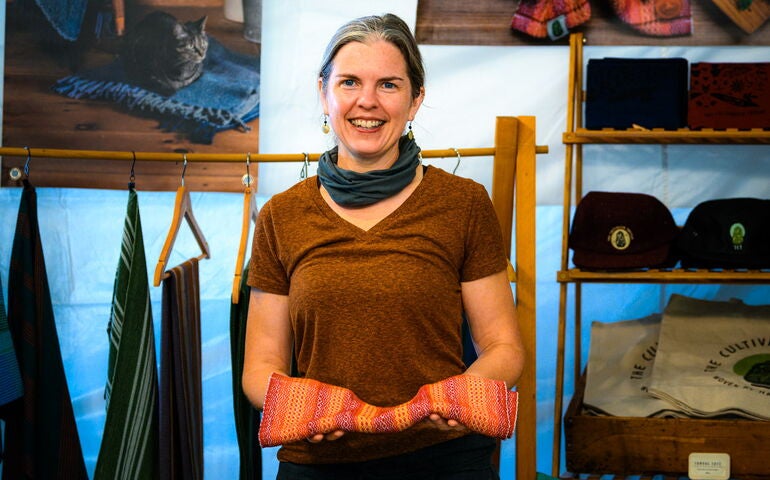 Person holding woven towel 