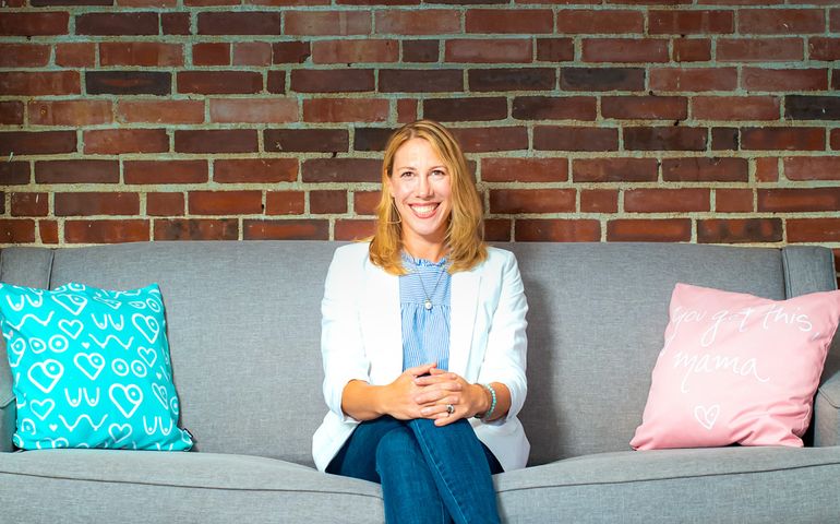 AmyVanHaren sitting on a couch.