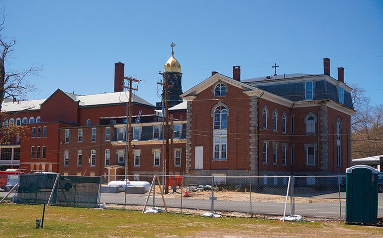 a large brick ornate building under construction