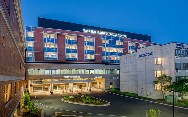 Hospital building exterior at night 