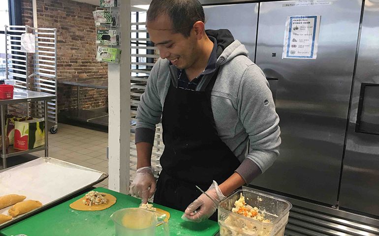 Adrian Espinoza making empanadas 