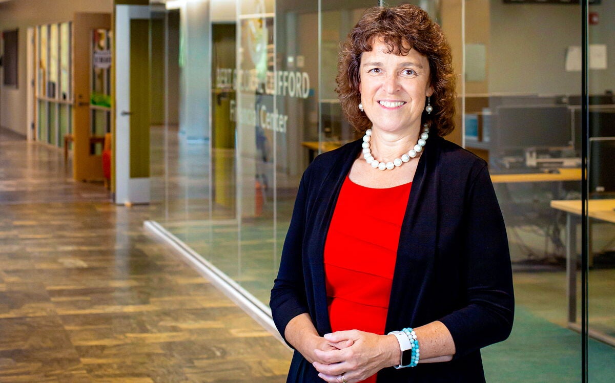 Laurie Lachance standing in Thomas College building 